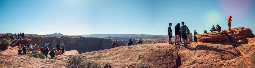 People on the edge of the cliff at Horseshoe Bend, Colorado River, Page, Arizona, USA.