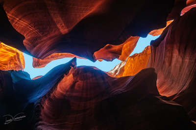 Stunning view looking up in Antelope Canyon, Arizona, United States.The reflected light from above is creating flowing patterns in the sandstone wall.