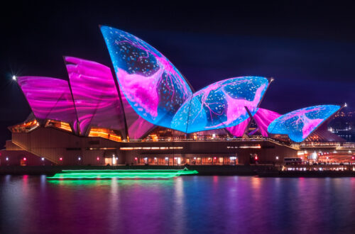 Illuminating Opera House's roofs with an art work representing a pulsating sea creature in amazing colors at Vivid Sydney Festival in 2017, in Australia.