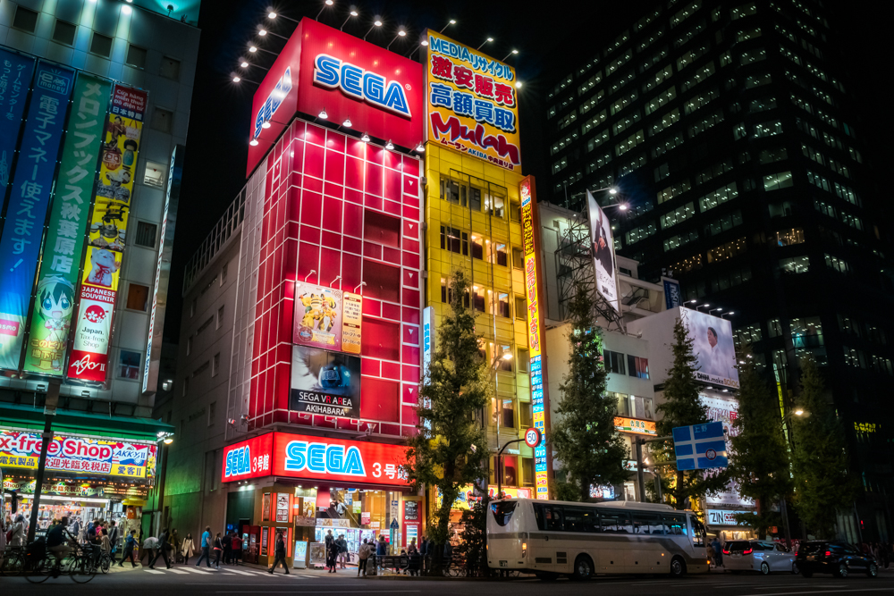 Tokyo scene at night with colorful billboards in Akihabara. 