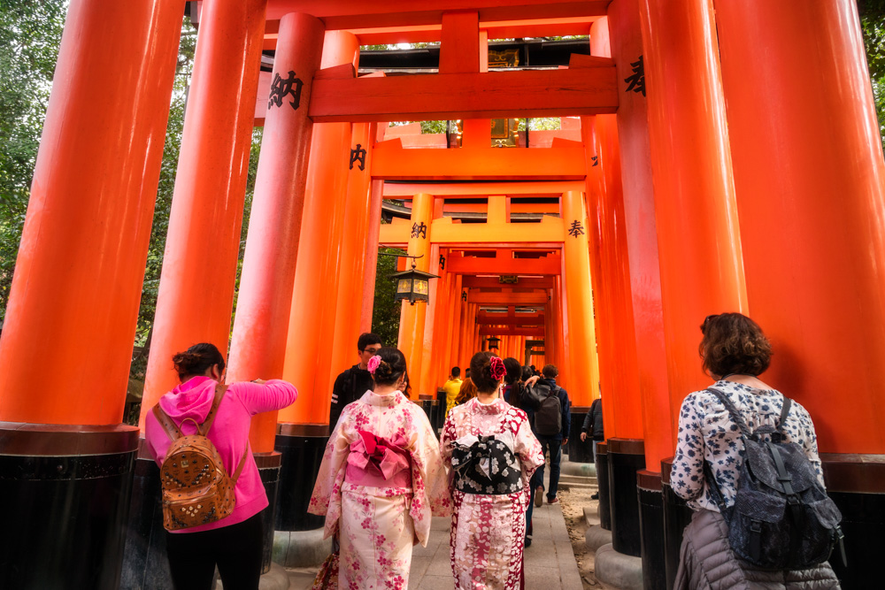 People visiting Fushimi Inari Shrine in Kyoto also called Senbon Torii, one of the most visited in Kyoto